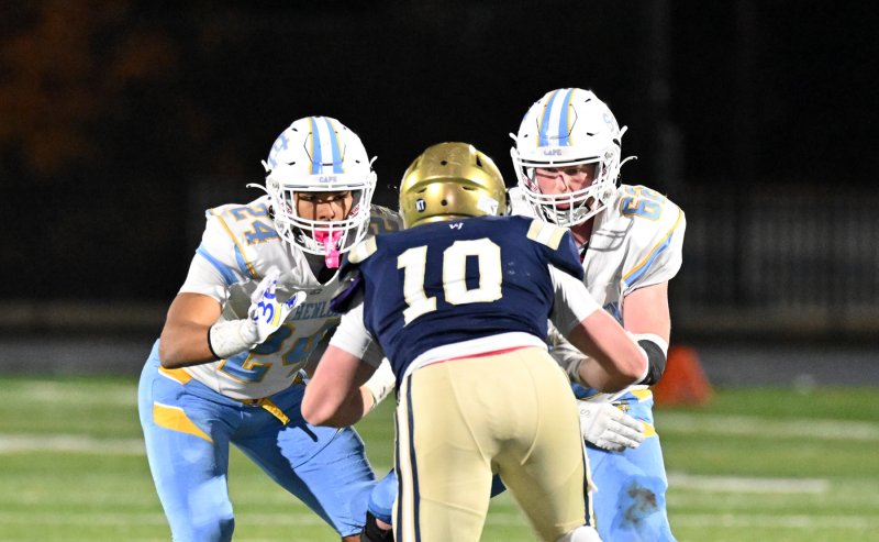 Seniors Dell Richards and Liam Ramsey double team Sallies’ Ryan VanKerkhoven.