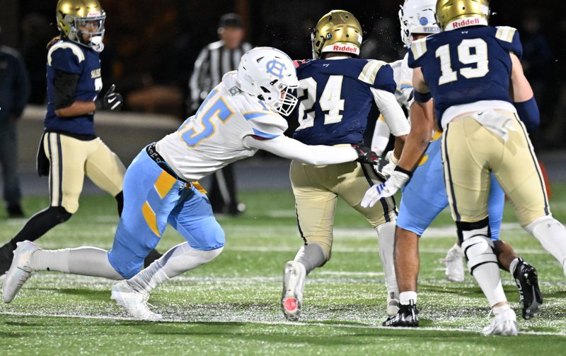 Cape senior Braden Wiswall pulls down Sallies running back EJ Cotton.