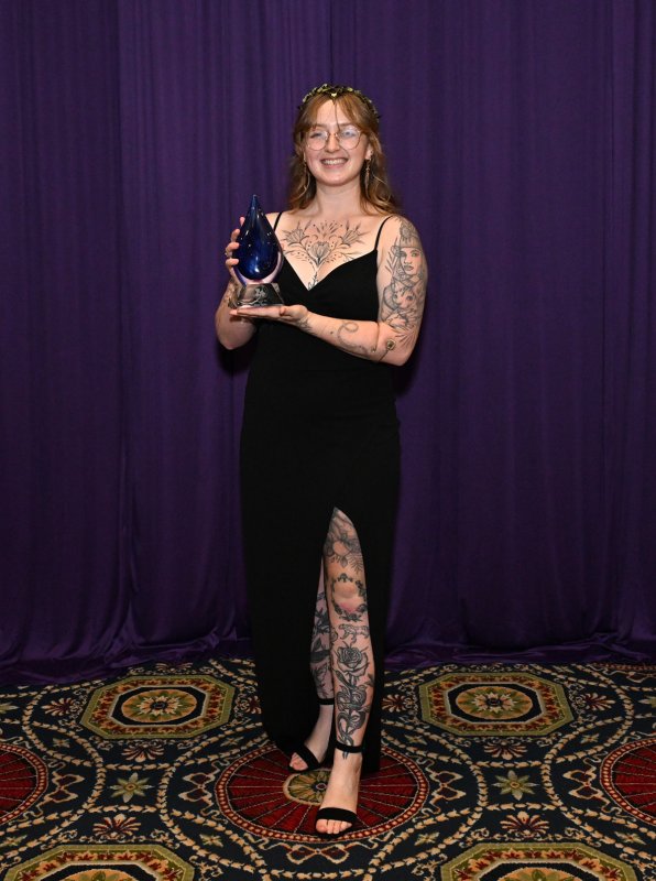 Alyse Ritzler, left, receives the Rookie of the Year Award.