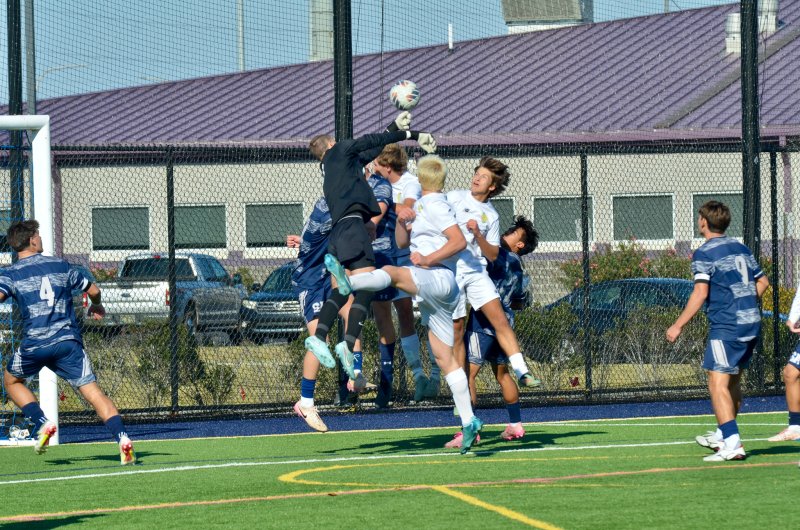 Seahawks keeper Austin Taylor punches the ball away from an always-dangerous Cape aerial attack.