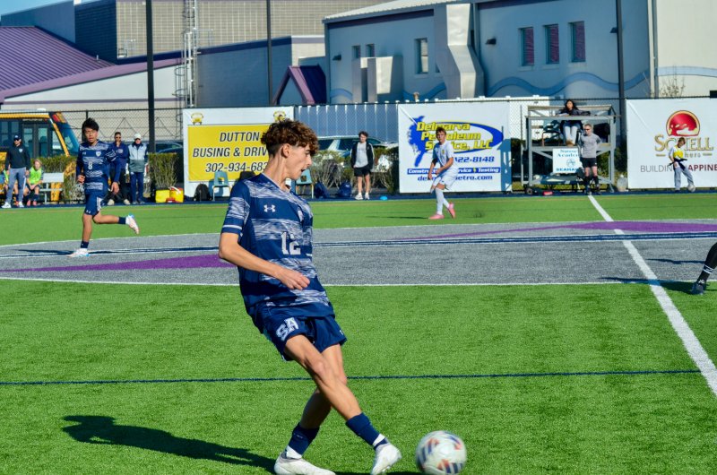 Seahawks freshman Alex Horner passes the ball across midfield.