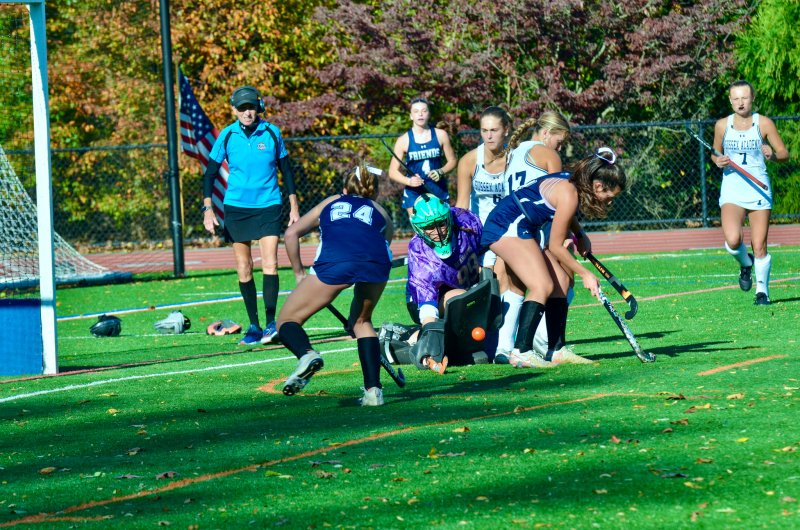 SUssex Academy senior Kacie Rawlings makes a save in the muck.