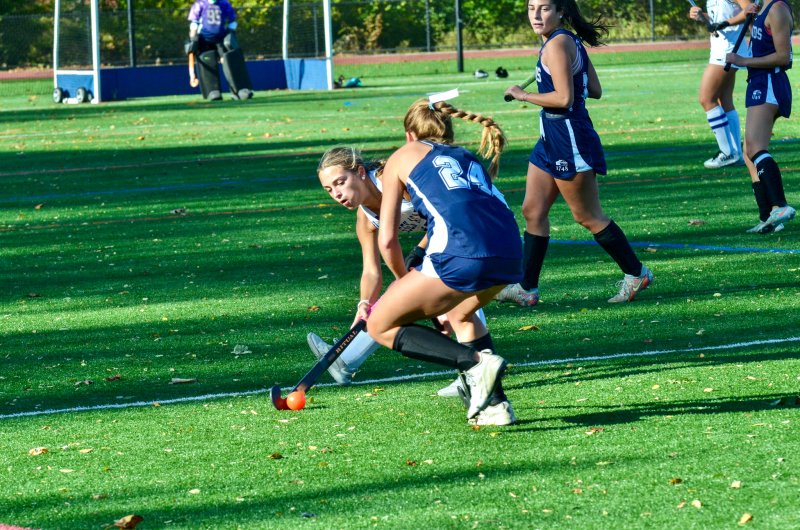 Sussex Academy sophomore Logan Stiles tries to pass around her defender.