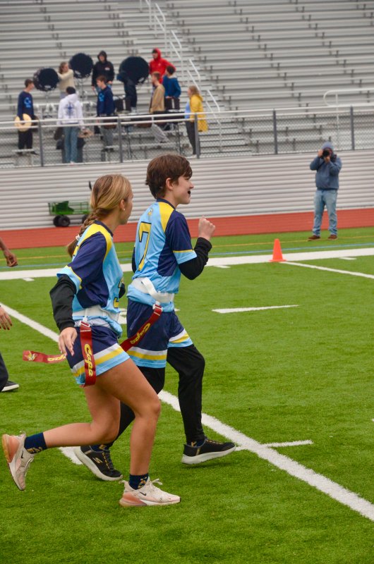 Vikings sophomore Harley Jones leads the way with Addison Wood in tow.