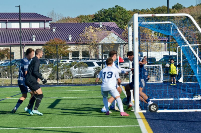 Sussex Academy senior Ben Steimel gets his foot on the ball just before it reaches the goal line.
