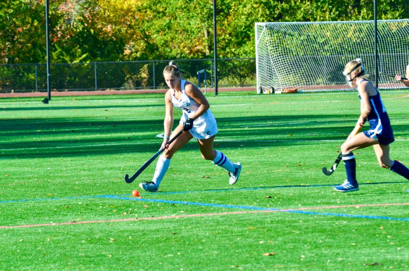 Sussex Academy sophomore Mave Lawson runs around her defender.