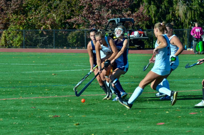 Sussex Academy sophomore Mave Lawson is roughed up a bit on her carry.