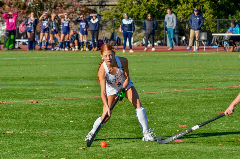 Sussex Academy freshman Emma Orlen tries to avoid a poke check.