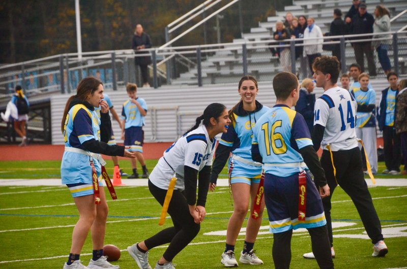 Middletown senior Jasmine Kaur shares a laugh on the play with Cape senior Mya DiSabatino, left, and Emma Fischer joining in.