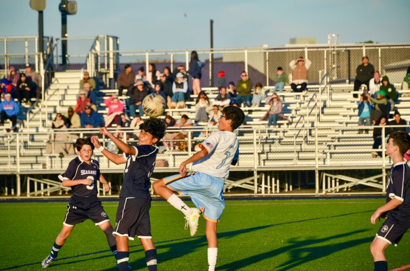 Sussex Academy seventh-grader Gadiel Velasquez wins a header.