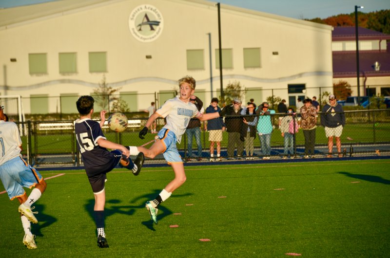 Vikings eighth-grader Liam Tyndall tries to get a foot on the ball before Seahawks eighth-grader Austin DeSantis can.