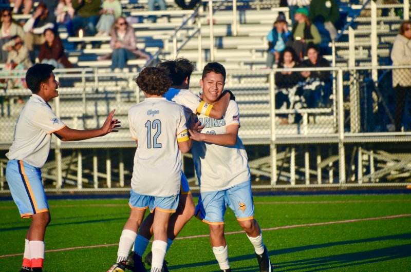 Mariner seventh-grader Juan Panuceno Rodriguez sports a smile as he is congratulated by his captains for scoring from 40 yards out on a set piece in the Vikings’ 2-1 win over Sussex Academy Nov. 5 in the season finale for both teams. AARON R. MUSHRUSH PHOTOS