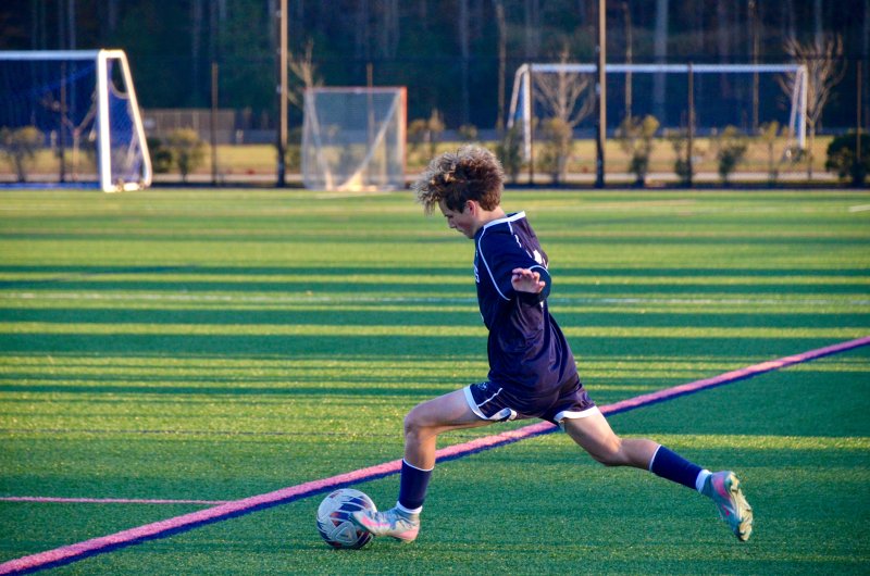 Seahawks eighth-grader Ethan Marsch boots the ball near the sideline.