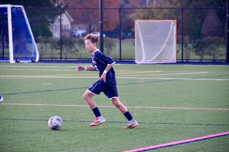 Sussex Academy seventh-grader Nick Musin looks upfield.
