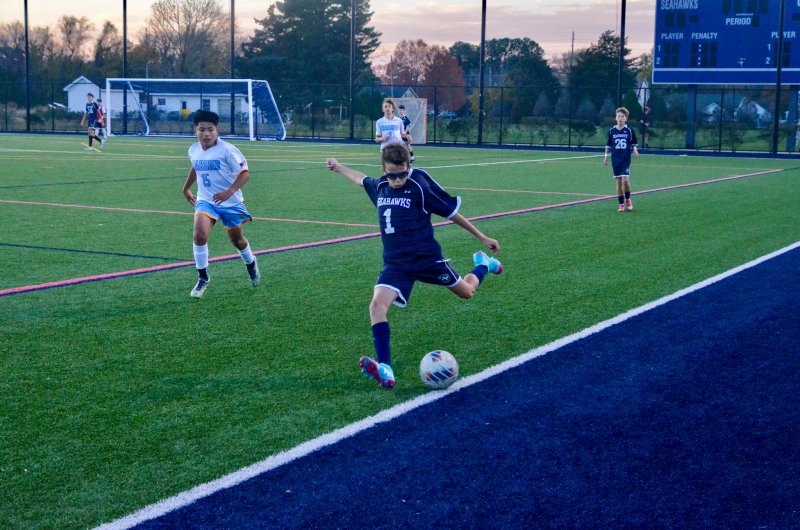 Seahawks seventh-grader Eli Evans saves the ball before it rolls out.