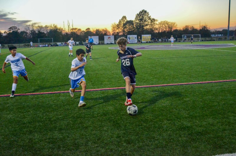 Seahawks seventh-grader Nick Musin rolls the ball back.