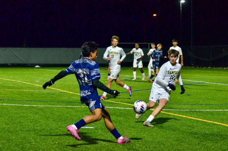 Sussex Academy junior Brandon Jaimes keeps the ball in the attacking third.