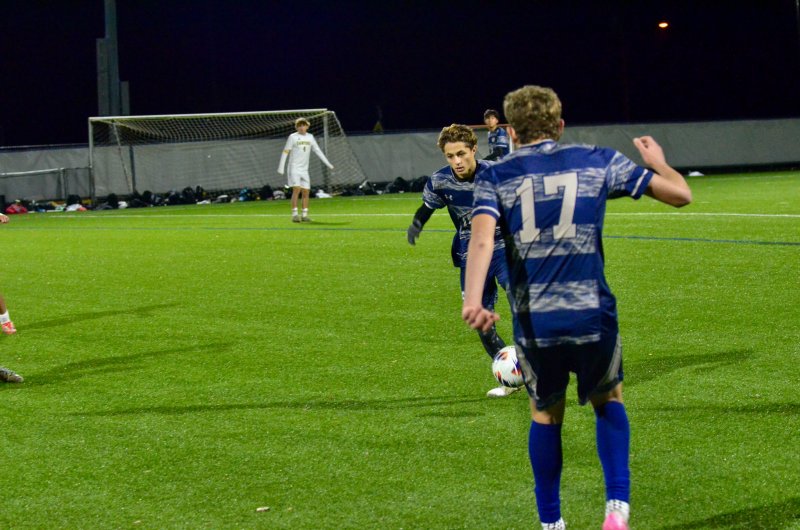 Sussex Academy senior Chase Ballinger prepares to receive a pass from his classmate Liam Stegall.