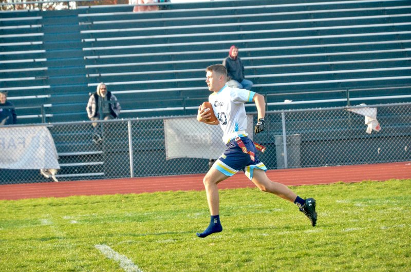 Shoeless Jaxon Benton scampers into the end zone toward the end of the first half.