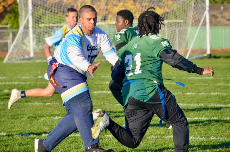 Vikings junior Austin Hastings zooms in on the flag of James Hayman.