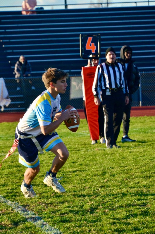 Cape sophomore Pierce Conway scrambles to his right.