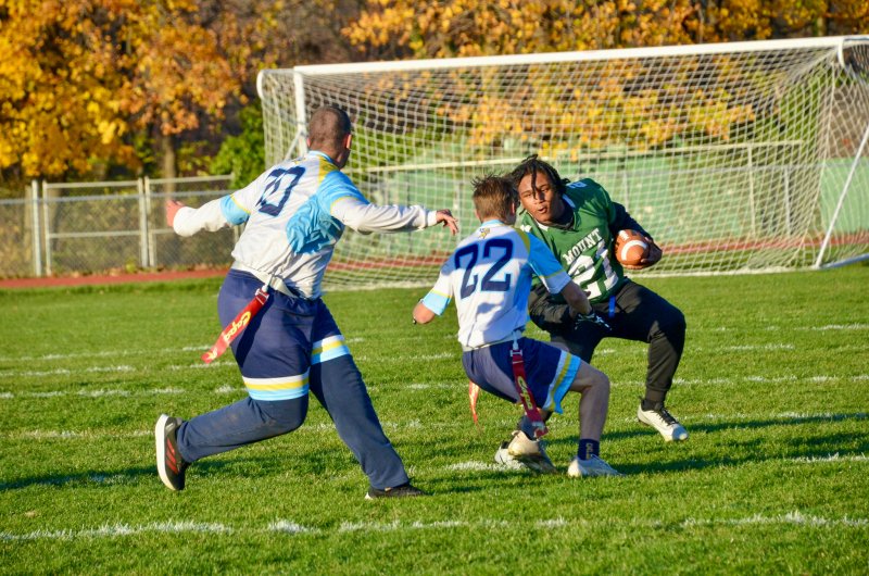Cape senior Mason Trench breaks down Mount Pleasant junior James Hayman with Austin Hastings swooping in for support.