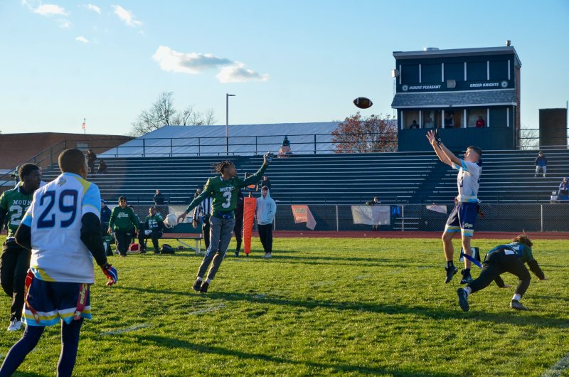 Vikings junior Jaxon Benton leaps up for a deep ball before turning and bolting into the end zone.