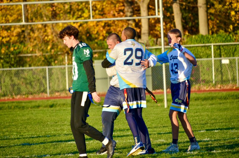 Vikings senior Zane Richardson hugs Austin Hastings after the latter scored a crucial touchdown in the closing moments. Jaxon Holgerson shares the love.