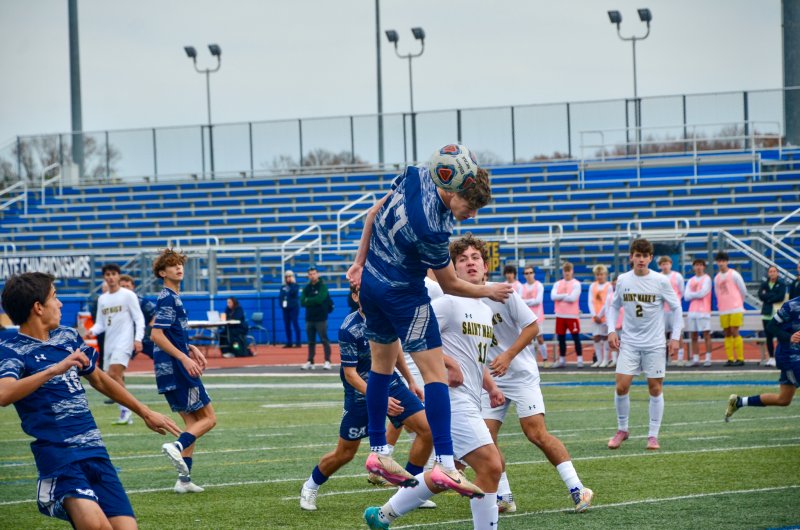 Seahawks senior Chase Ballinger gets a header in the box.