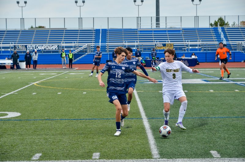 Seahawks freshman Alex Horner locks claws with Spartans senior Gabriel Arick.