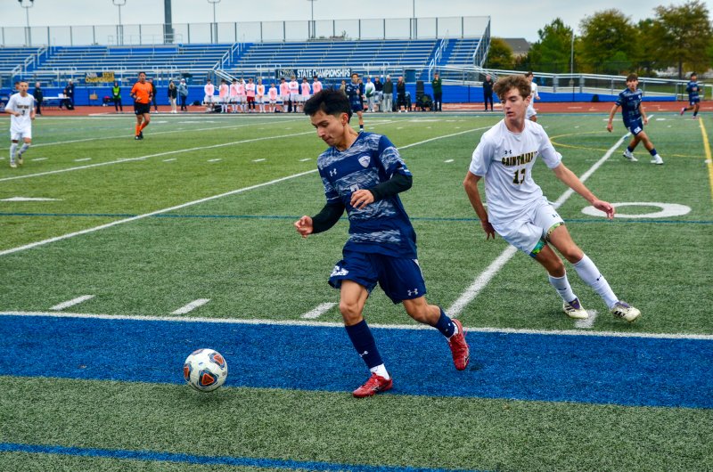 Sussex Academy junior Jose Figueroa-Morales turns around Saint Mark’s senior Luke Podolak.