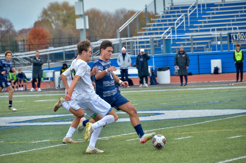 Sussex Academy senior Ben Steimel absorbs some contact on a carry.