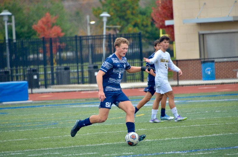 Seahawks junior Carson Klahr begins to pass the ball.
