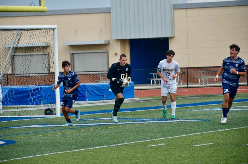 Sussex Academy senior Ben Steimel, voices his approval of his classmate Austin Taylor’s save as Bodhi Williams breaks out for a potential outlet.