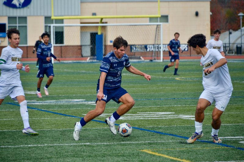 Sussex Academy All-American George Sapna slices through the Saint Mark’s defenders.