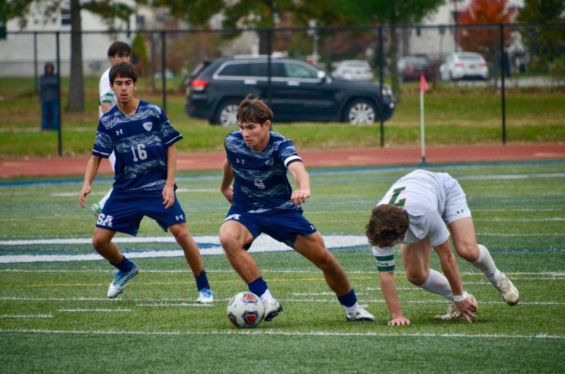 Seahawks senior George Sapna carries the ball with strength.