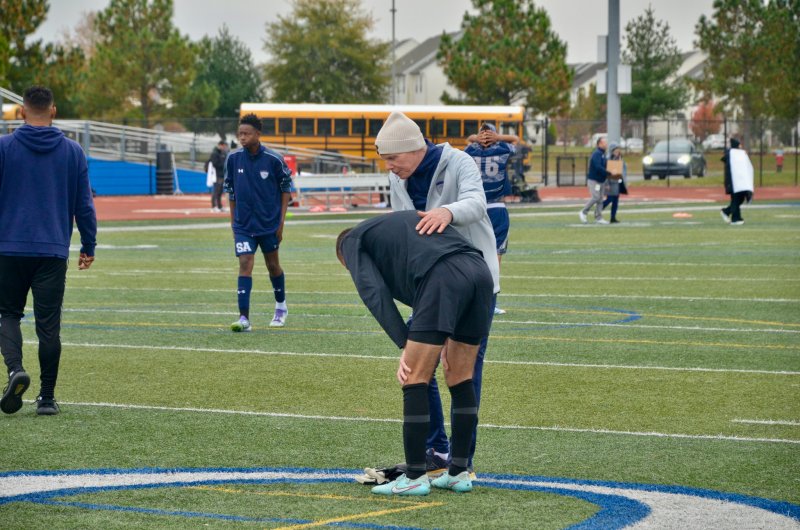 Seahawks JV coach Tom O’Donnell consoles Austin Taylor.