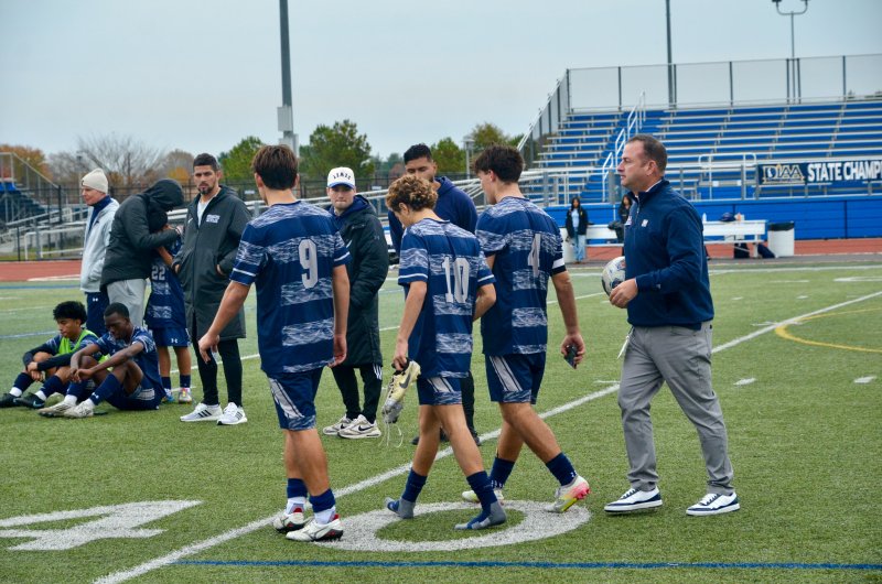 Sussex Academy captains (l-r) George Sapna, Liam Stegall and Ben Steimel head back to their team with the second-place trophy.