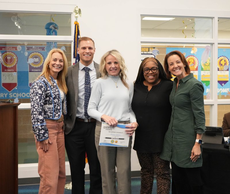 Shirley Osborne, Love Creek Elementary School cafeteria manager, receives the Cape Henlopen School District's Going the Extra Mile staff award for November. Pictured are (l-r) Superintendent Jenny Nauman, Love Creek Assistant Principal James McDowell, Osborne, Principal Equetta Jones and Board President Alison Myers. ELLEN MCINTYRE PHOTOS
