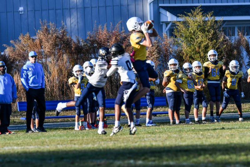Brady Sherman of Fred Thomas Middle goes high for a catch.