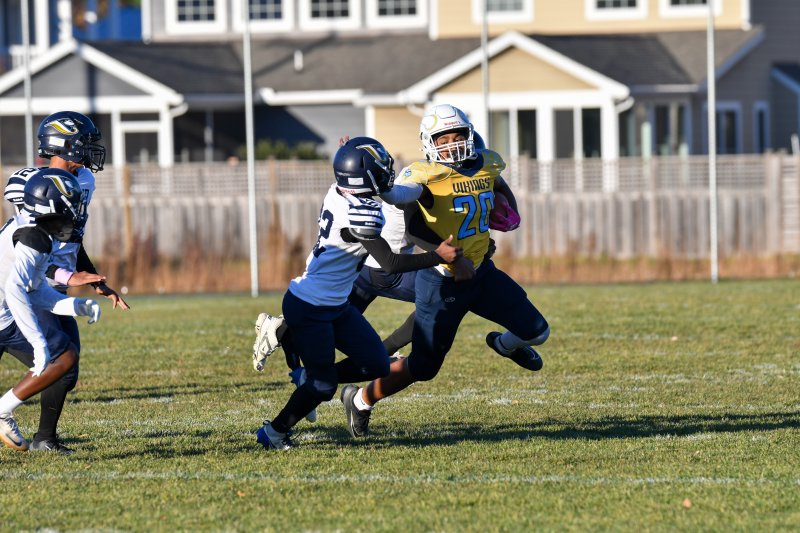 Arristyn Richards of Fred Thomas Middle circles the left end for positive yardage.