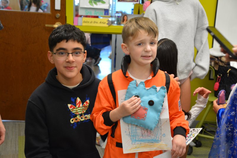Mariner MS student Alameen Odeh and Eli Tyndall of Milton Elementary pose for a photo with Eli’s monster that Alameen created.