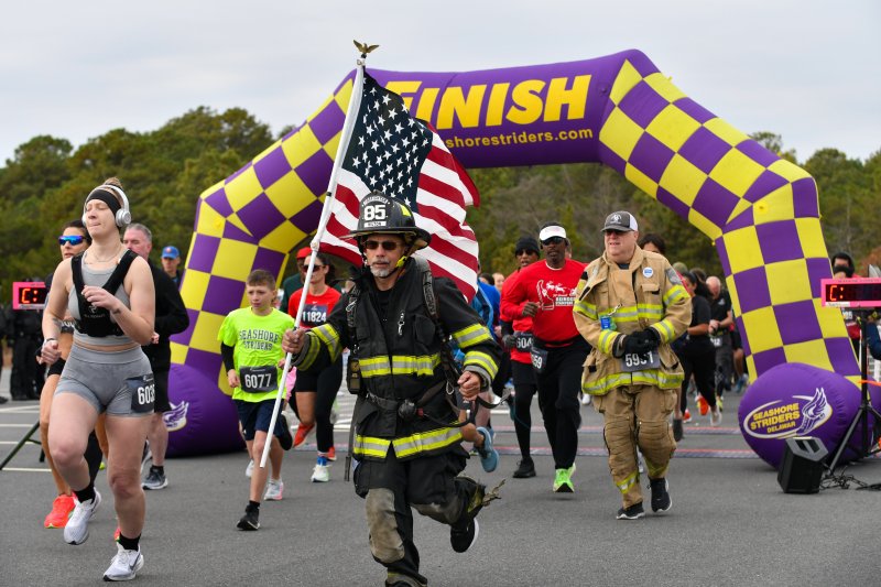 Allen Jackson of Station 85 in Milton runs the Tunnel to Towers race in full turnout gear Nov. 15. DAVE FREDERICK PHOTOS