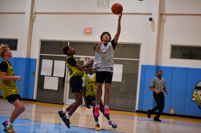 Fred Thomas basketball player Cam Bell goes left for a layup.