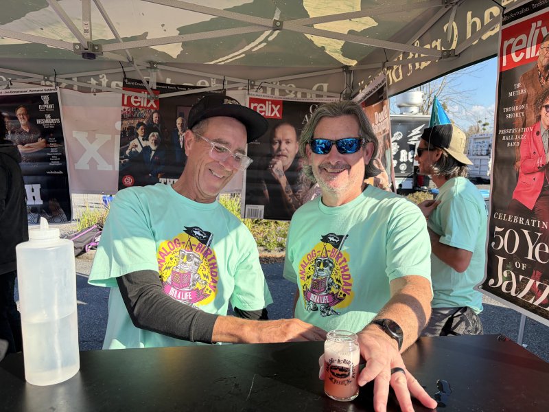 Grant Halliday, left, and Dave Vezmar, serve up Dogfish’s Pan-Am Jam Band beer, a collaboration with music magazine Relix.