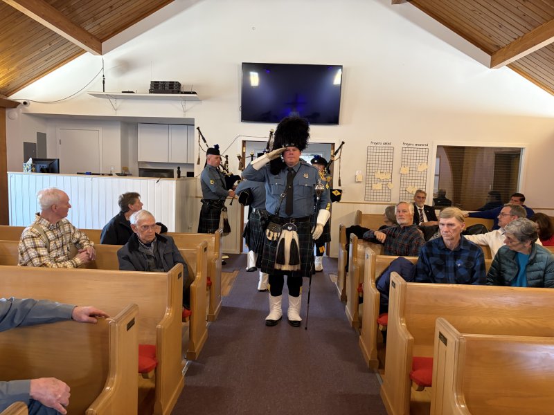 The Delaware State Police Pipes and Drums Corps performs.