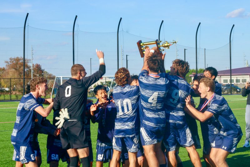 Members of the Sussex Academy boys’ soccer team joyously perform the obligatory trophy raise after winning the Henlopen Conference championship game for the third year in a row with a 2-0 victory over Cape Nov. 1, a rematch of the 2024 final. AARON R. MUSHRUSH PHOTOS