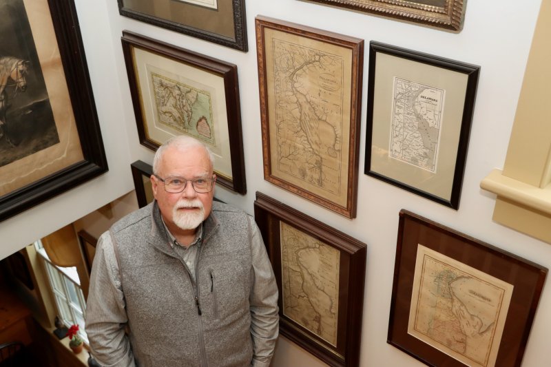 Kevin Moore in front of part of his historic map collection. “They have to show Lewes,” he said. Moore said his oldest map dates back to the 1730s.
BILL SHULL PHOTO