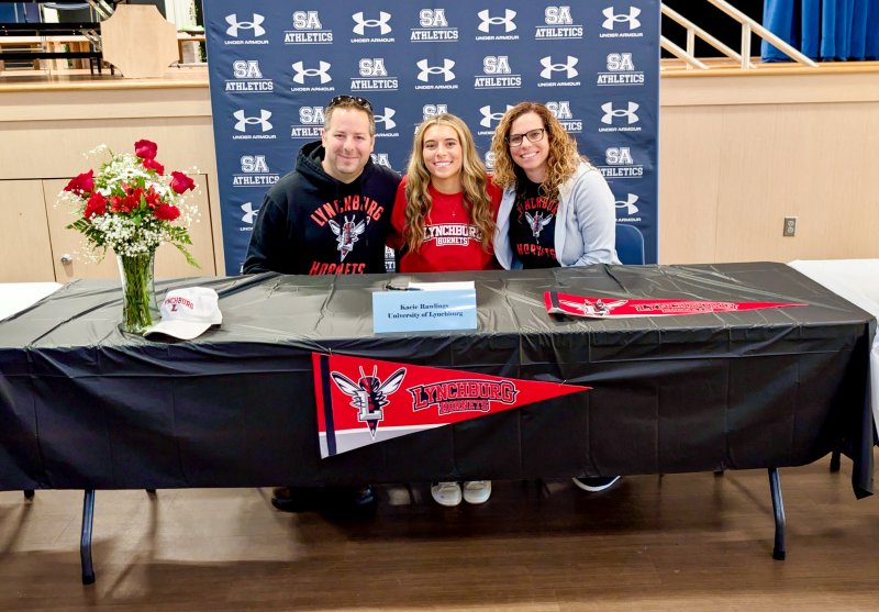 Sussex Academy senior Kacie Rawlings smiles with her mom Kara Rawlings and Dayne Eisele by her side.