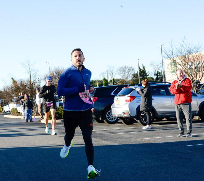 Andrew Merlo, former Cape point guard, crosses the line in 19:34.